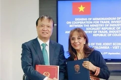 Thứ trưởng Bộ Công Thương Đỗ Thắng Hải và Thứ trưởng Bộ Thương mại, Công nghiệp và Du lịch Colombia Soraya Caro Vargas. (Ảnh: TTXVN phát)