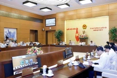 Tiếp tục chương trình Phiên họp thứ 37, sáng 23/9/2024, tại Nhà Quốc hội, Ủy ban Thường vụ Quốc hội cho ý kiến về dự án Luật sửa đổi bổ sung một số điều của Luật Sỹ quan Quân đội nhân dân Việt Nam và dự án Luật Thuế thu nhập doanh nghiệp (sửa đổi). (Ảnh: Doãn Tấn/TTXVN)