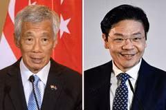 Thủ tướng Singapore Lý Hiển Long (trái) và Phó Thủ tướng Lawrence Wong. (Ảnh: AFP/TTXVN)