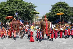 Màn rước kiệu tại lễ hội Chử Đồng Tử-Tiên Dung Công chúa ở xã Tự Nhiên (huyện Thường Tín, Thành phố Hà Nội). (Ảnh: Trấn Việt/TTXVN) 