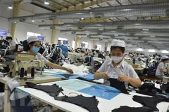 Các doanh nghiệp vẫn đối mặt với nhiều thách thức trong thời gian tới. (Ảnh: Hoàng Nhị/TTXVN) 