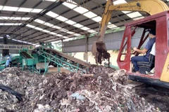 Mô hình xử lý rác thải bằng công nghệ vi sinh không gây ô nhiễm môi trường. (Ảnh: Nguyễn Nam/TTXVN)