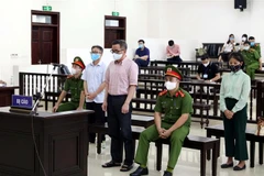 Các bị cáo tại phiên tòa. (Ảnh: Phạm Kiên/TTXVN) 