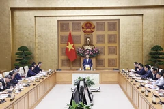 Phó Thủ tướng Trần Hồng Hà chủ trì cuộc họp lấy ý kiến về Chiến lược phát triển giáo dục. (Ảnh: Văn Điệp/TTXVN)