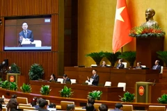 Phó Thủ tướng Chính phủ, Bộ trưởng Bộ Tài chính Hồ Đức Phớc giải trình, làm rõ một số vấn đề đại biểu Quốc hội nêu. (Ảnh: Doãn Tấn/TTXVN)