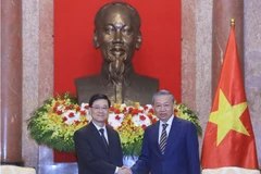 Chủ tịch nước Tô Lâm tiếp Trưởng Khu hành chính đặc biệt Hong Kong (Trung Quốc) Lý Gia Siêu. (Ảnh: An Đăng/TTXVN)