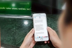 Đăng ký online mua vàng miếng SJC tại Vietcombank. (Ảnh: TTXVN phát)