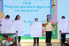 Các trẻ em có hoàn cảnh đặc biệt khó khăn tham gia diễn đàn lắng nghe tiếng nói trẻ em với chủ đề “Phòng ngừa, giảm thiểu lao động trẻ em” tại Hội trại. (Ảnh: Thanh Vũ/ TTXVN)