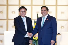 Thủ tướng Phạm Minh Chính tiếp ông Lou Qiliang, Chủ tịch Tập đoàn Truyền thông và Tín hiệu Đường sắt Quốc gia Trung Quốc. (Ảnh: Dương Giang/TTXVN)