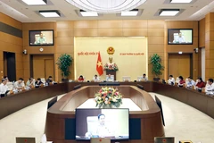 Ủy ban Thường vụ Quốc hội cho ý kiến về việc giải trình, tiếp thu, chỉnh lý 2 dự thảo Luật Phòng cháy, chữa cháy và cứu nạn, cứu hộ và Luật Thuế giá trị gia tăng (sửa đổi). (Ảnh: Doãn Tấn/TTXVN)