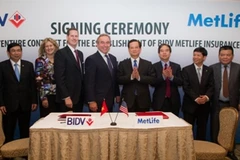 Hai doanh nghiệp ký kết dưới sự chứng kiến của Thủ tướng Nguyễn Tấn Dũng. (Nguồn: BIDV).