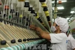 Sản xuất sợi xuất khẩu tại Công ty Dệt Hà Nam (Khu Công nghiệp Châu Sơn - Hà Nam). (Ảnh Trần Việt/TTXVN). 