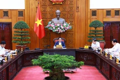 Thủ tướng Phạm Minh Chính chủ trì cuộc họp về chính sách tài khóa. (Ảnh: Dương Giang/TTXVN)