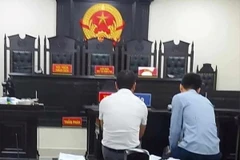 Hai bị cáo Thắng và Tuấn tại phiên tòa. (Ảnh: Báo Công lý)