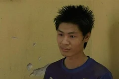 Đối tượng gây án Đỗ Mãnh Chiểu Minh tại cơ quan công an. (Ảnh: Khiếu Tư/TTXVN)