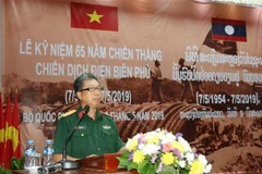 Tùy viên Quốc phòng Việt Nam tại Lào, Đại tá Tào Văn Thái, phát biểu tại buổi lễ. (Ảnh: Xuân Tú/TTXVN)