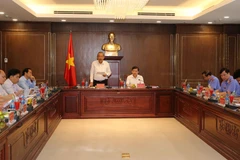 Phó Thủ tướng Thường trực Chính phủ Trương Hòa Bình phát biểu, công bố dự thảo báo cáo. Ảnh: Doãn Tấn - TTXVN