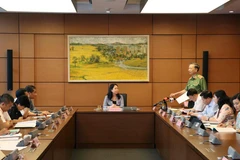 Đại tướng Tô Lâm, Bộ trưởng Bộ Công an, Đại biểu Quốc hội tỉnh Bắc Ninh thảo luận tại tổ. (Ảnh: Văn Điệp/TTXVN)