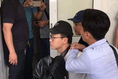 Nghi phạm lúc bị trinh sát bắt giữ.