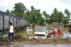 Cảnh ngập lụt ở thành phố Iligan, đảo Mindanao ngày 17/12 sau khi cơn bão Washi tràn qua. (Nguồn: AFP/TTXVN)