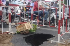 Một hố tử thần xuất hiện trên đường ở Thành phố Hồ Chí Minh. (Nguồn: Ảnh: Hoàng Anh Tuấn/Vietnam+)