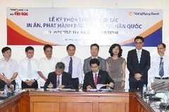 Quang cảnh lễ ký kết. (Ảnh: Phương Hoa/TTXVN)