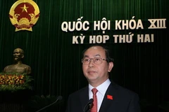 Bộ trưởng Bộ Công an Trần Đại Quang trình bày Báo cáo công tác phòng ngừa, chống vi phạm pháp luật và tội phạm. (Ảnh: Thống Nhất/TTXVN)