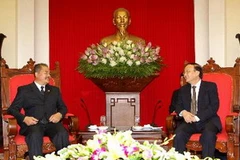 Trưởng Ban Tổ chức Trung ương Tô Huy Rứa tiếp ông Kikẹo Khảykhămphithun, Ủy viên Trung ương Đảng, Giám đốc Học viện Chính trị-Hành chính Quốc gia Lào. (Ảnh: An Đăng/TTXVN)