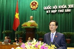 Thủ tướng Nguyễn Tấn Dũng trình bày Báo cáo của Chính phủ về tình hình kinh tế-xã hội năm 2013, kết quả 3 năm thực hiện kế hoạch 5 năm (2011-2015) và nhiệm vụ 2014-2015. (Ảnh: Nhan Sáng/TTXVN)