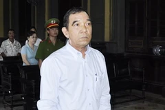 Ông Hùynh Ngọc Sĩ trong phiên tòa sử án ngày thứ 2. (Ảnh: Mạnh Linh/TTXVN)