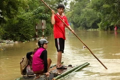 Cảnh ngập lụt tại thị trấn huyện Minh Hóa. (Ảnh: Duy Hưng-Mạnh Thành/TTXVN)