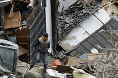 Cảnh đổ nát sau động đất ở Nhật Bản. (Nguồn: AFP/TTXVN)