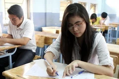 Thí sinh tham gia kỳ thi cao đẳng năm 2011. (Ảnh: Phương Vy/TTXVN)