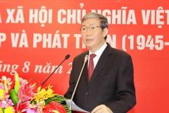 Trưởng ban Tuyên giáo Trương ương Đinh Thế Huynh phát biểu tại Hội thảo. (Ảnh: An Đăng/TTXVN)