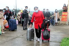 Công dân hoàn thành thời gian cách ly tập trung chuẩn bị trở về với gia đình. (Ảnh minh họa. Văn Đạt/TTXVN)