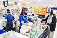 Các điểm bán thuộc Saigon Co.op đảm bảo quy định phòng, chống dịch bệnh COVID-19. (Ảnh: TTXVN phát)