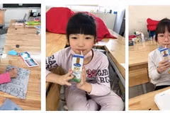 Những hộp sữa đã đến với các em học sinh tại trường Xuân Phương. Mỗi bé sẽ được bổ sung 2 hộp sữa mỗi ngày. (Nguồn: Vietnam+)