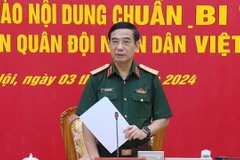 Đại tướng Phan Văn Giang, Ủy viên Bộ Chính trị, Phó Bí thư Quân ủy Trung ương, Bộ trưởng Bộ Quốc phòng, phát biểu tại Hội nghị. (Ảnh: Hồng Pha/TTXVN phát)