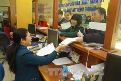 Hoạt động nghiệp vụ tại Cục Thuế Hà Nội. (Ảnh: Hoàng Hùng/TTXVN)