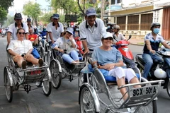 Du khách quốc tế tham quan Thành phố Hồ Chí Minh. (Nguồn: TTXVN)