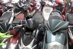 Các xe máy tang vật trong một vụ án phá đường dây tiêu thụ xe gian. (Ảnh: Thế Vinh/TTXVN)