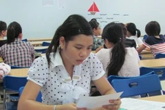 Thí sinh làm thủ tục dự thi tại Trường đại học Hà Nội năm 2010. (Ảnh: Phạm Mai/Vietnam+).
