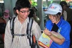 Thí sinh làm bài thi đại học. (Ảnh: Phạm Mai/Vietnam+)