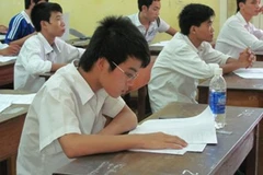 Thí sinh làm bài thi trong kỳ thi đại học năm 2010. (Ảnh: Phạm Mai/Vietnam+)