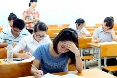 Thí sinh dự thi tại Hội đồng thi Học viện Tài chính. (Ảnh: Quý Trung/TTXVN)