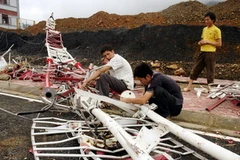 Tháp truyền hình huyện Tam Đường bị lốc xoáy quật đổ. (Ảnh: Công Hải/TTXVN)