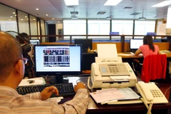 Các nhà đầu tư tổ chức rất chú trọng tới các báo cáo phát triển bền vững của doanh nghiệp. (Ảnh minh họa. Nguồn: TTXVN)