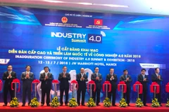 Lễ cắt băng khai mạc triển lãm quốc tế về công nghiệp, ngày 13/7. (Ảnh: PV/Vietnam+)