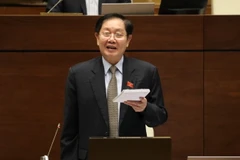 Bộ trưởng Nội vụ Lê Vĩnh Tân phát biểu làm rõ một số vấn đề đại biểu Quốc hội nêu. (Ảnh: Văn Điệp/TTXVN)