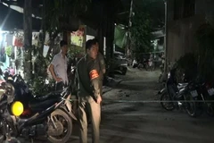 Lực lượng chức năng phong tỏa hiện trường. (Ảnh: Nguyễn Văn Việt/TTXVN)